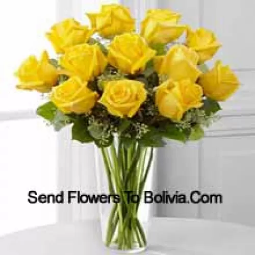 11 Yellow Roses With Some Ferns In A Glass Vase
