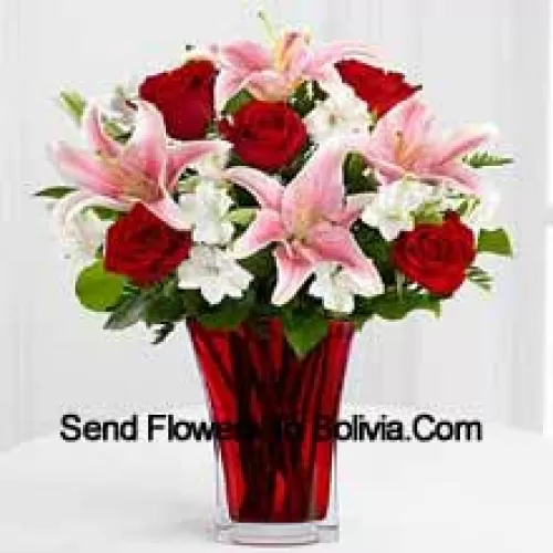 6 Red Roses And 5 Pink Lilies With Seasonal Fillers In A Beautiful Glass Vase